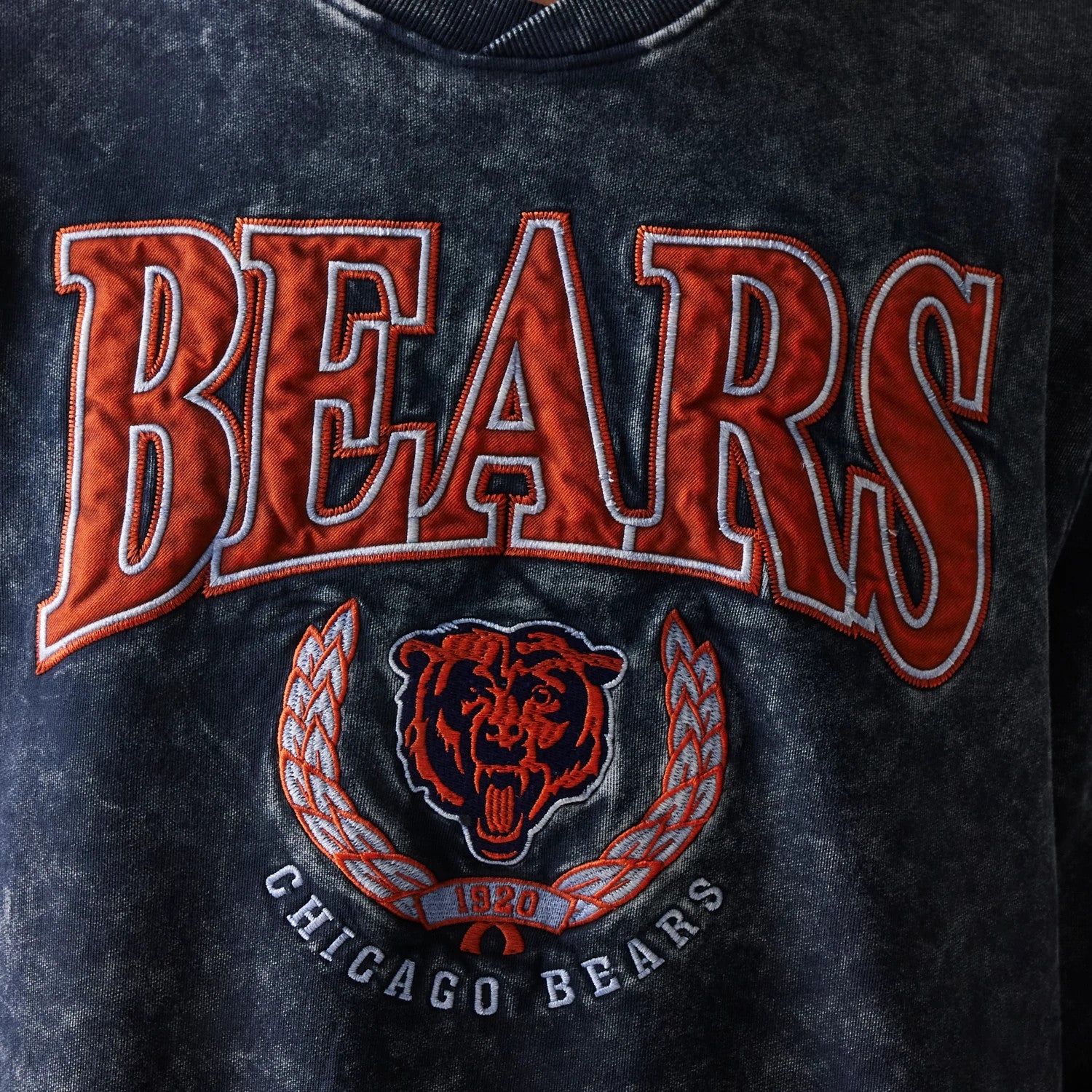 New Era Chicago Bears NFL Navy Crew Neck Sweater, front view showing large orange BEARS lettering across the chest with the team emblem and 1920 logo below against a textured navy background.