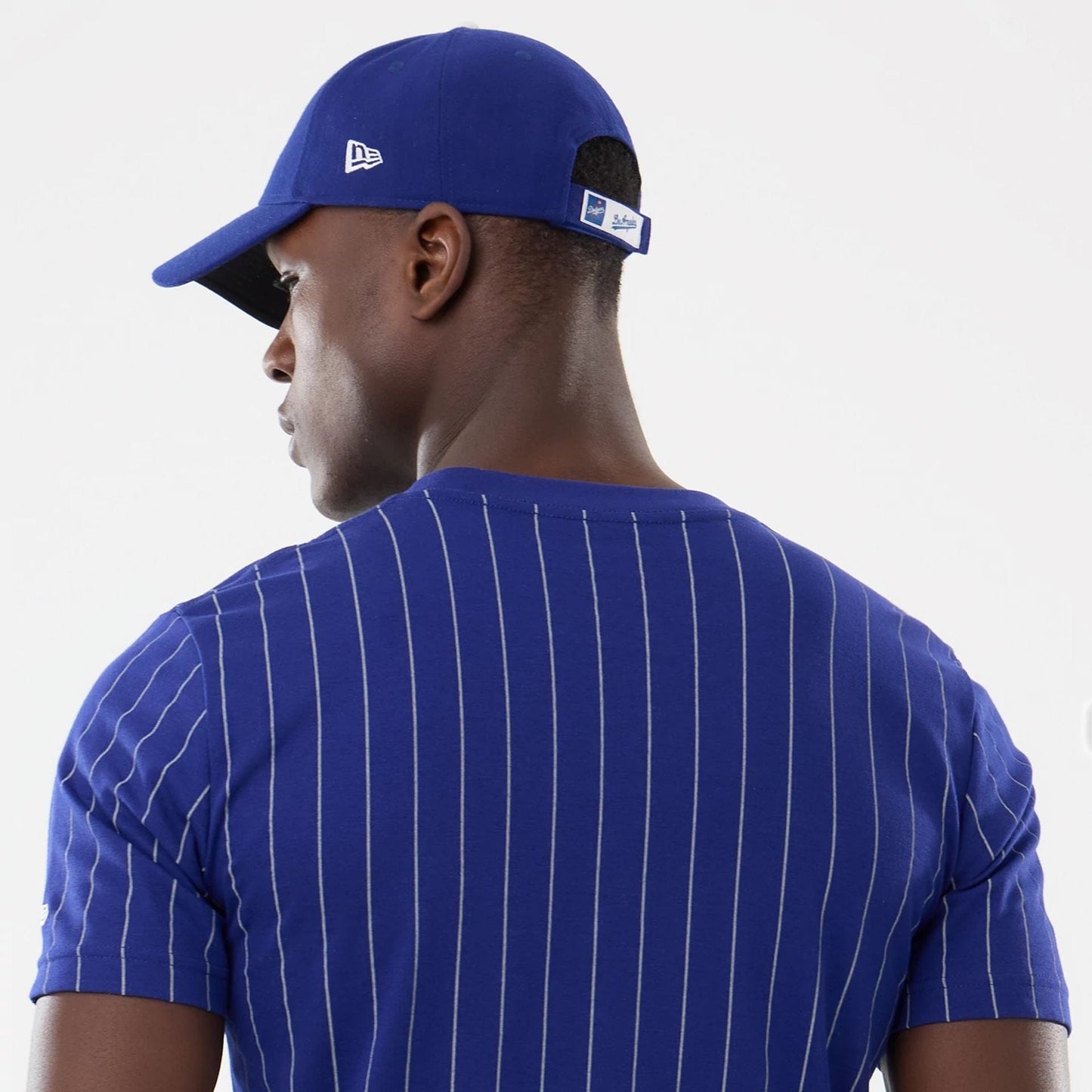 The model is wearing this MLB Pinstripe LA Dodgers T-Shirt in dark blue. 5
