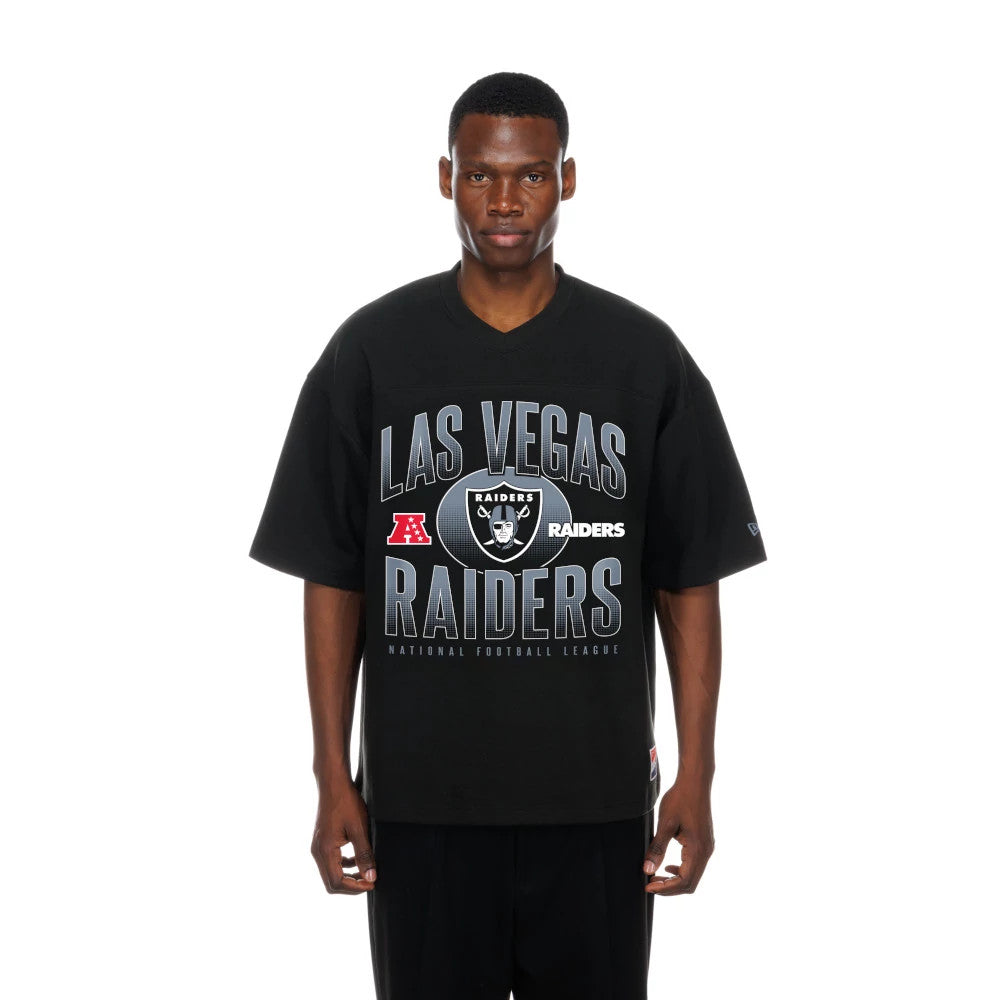 New Era Las Vegas Raiders NFL Black Boxy T-Shirt, front view showing Las Vegas Raiders lettering and the team logo prominently printed across the chest of the oversized black shirt, worn by a model with casual styling.