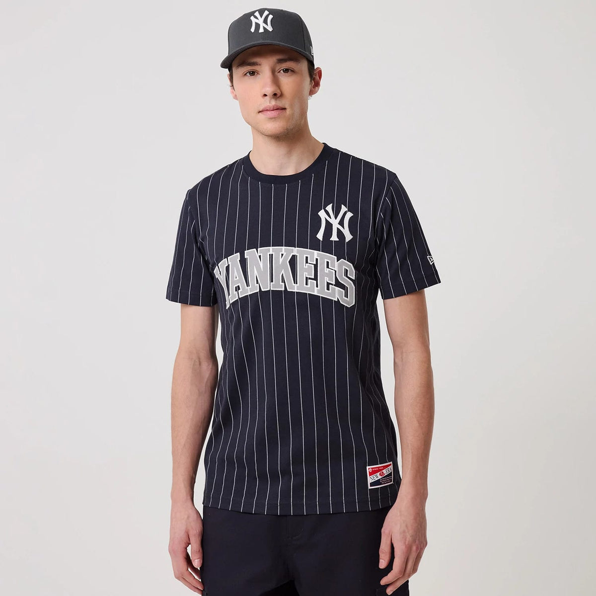 The model is wearing this MLB Pinstripe New York Yankees T-Shirt in navy. 1