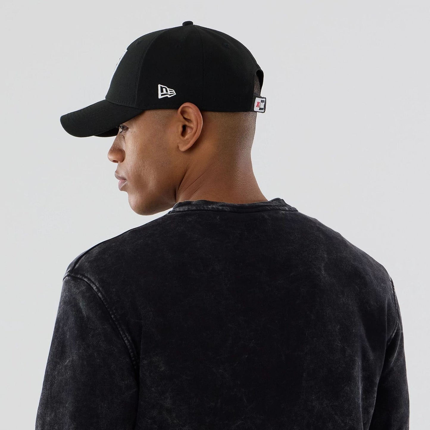 The model is wearing this NFL Las Vegas Raiders Crew Neck Sweater in black. 7