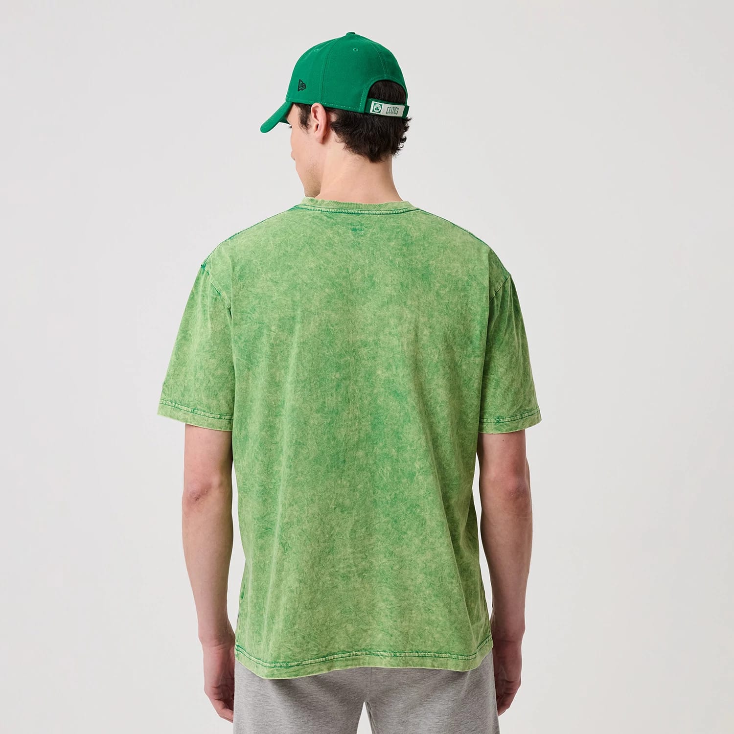 The model is wearing this NBA Boston Celtics T-Shirt in green. 2