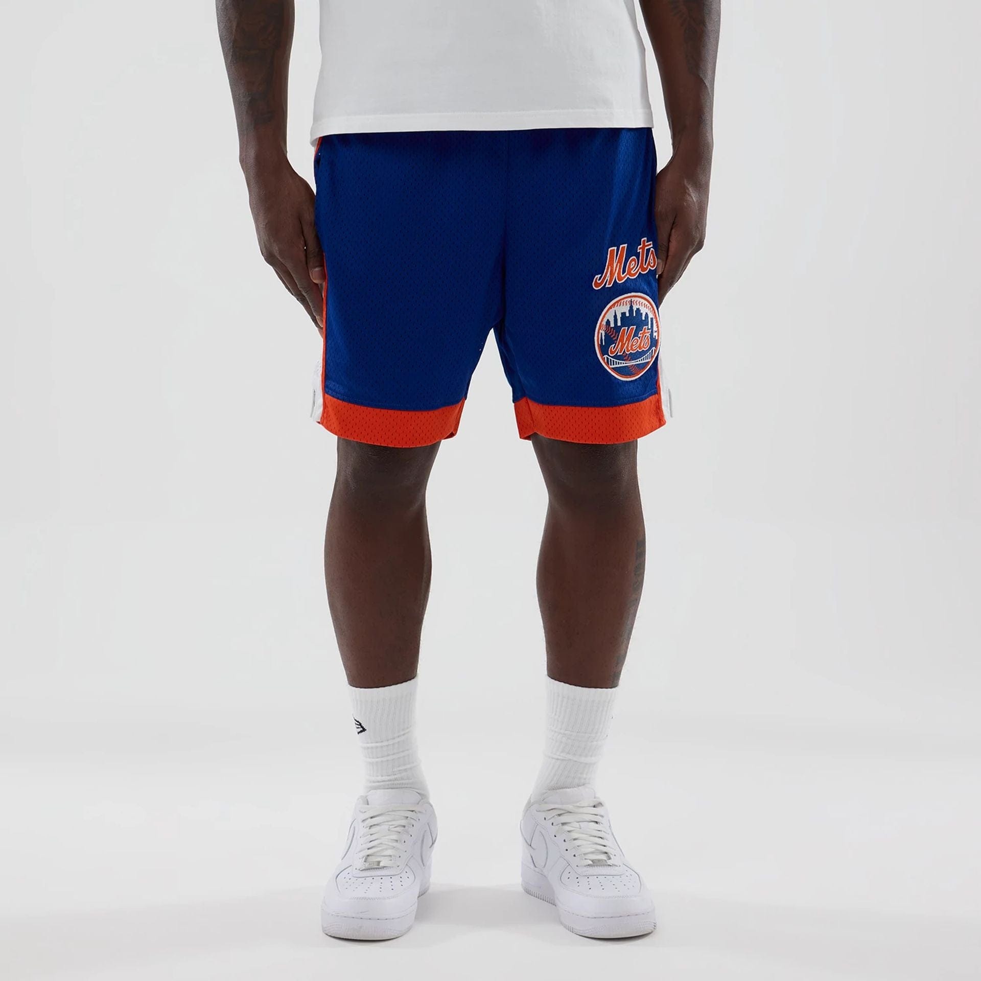 The model is wearing these MLB New York Mets Mesh Shorts in blue. 1