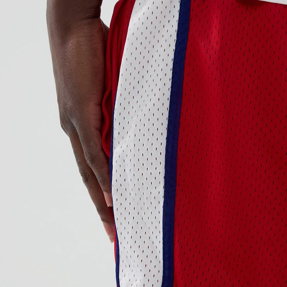 The model is wearing these MLB Philadelphia Phillies Mesh Shorts in red. 5