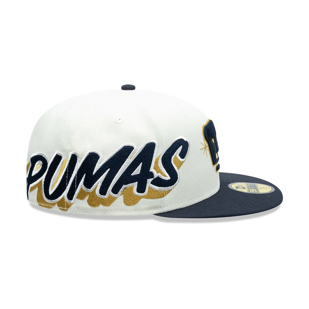 Pumas Unam Liga MX White New Era 59FIFTY Fitted Cap, side view showing large navy embroidered PUMAS lettering across the white crown, with a navy flat visor and gold 59FIFTY size sticker on top.