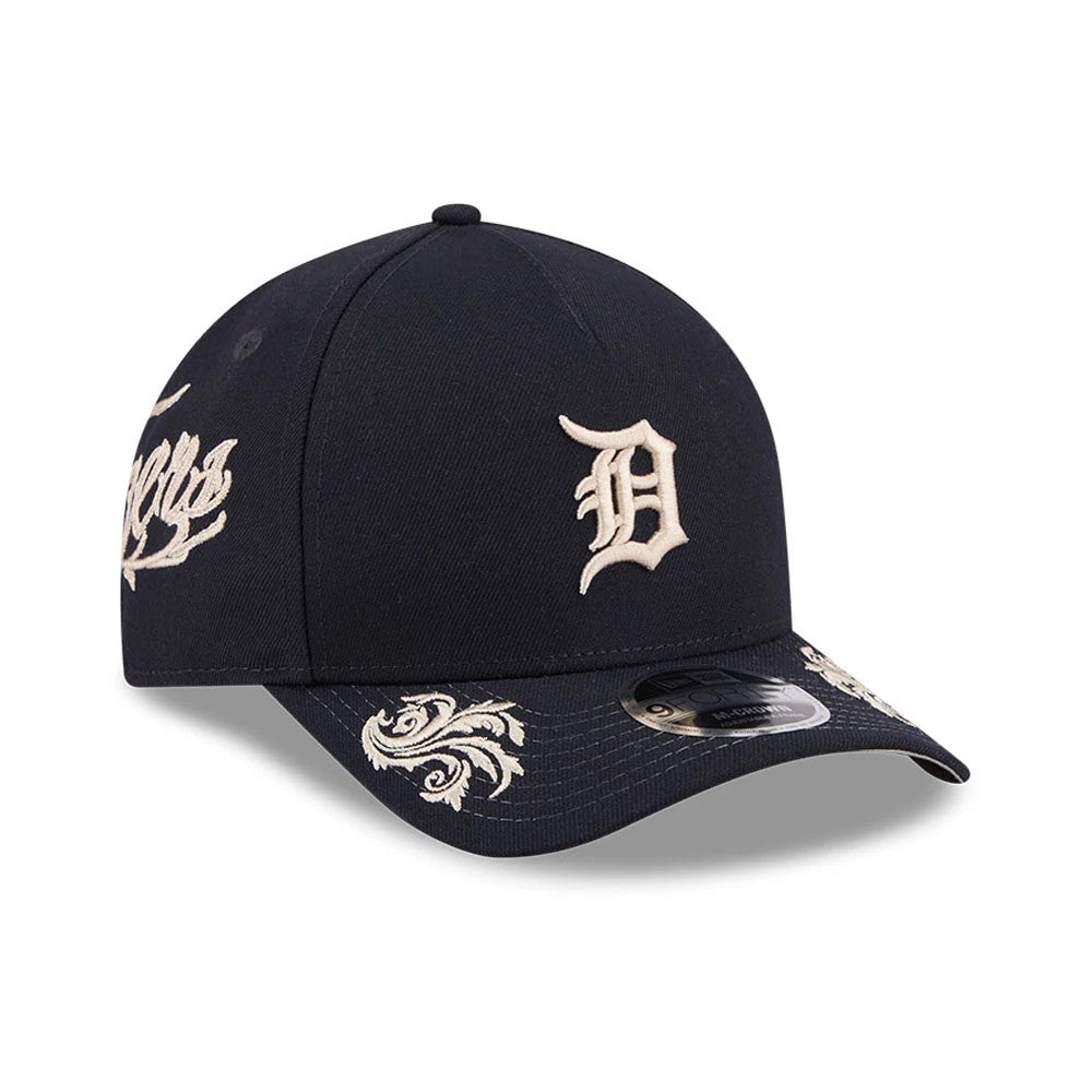 Detroit Tigers MLB Script Navy New Era 9FORTY M-Crown A-Frame Adjustable Cap, three-quarter view showing the cream embroidered D logo on the front panel, ornate visor detail and a 9FORTY size sticker on the curved visor.