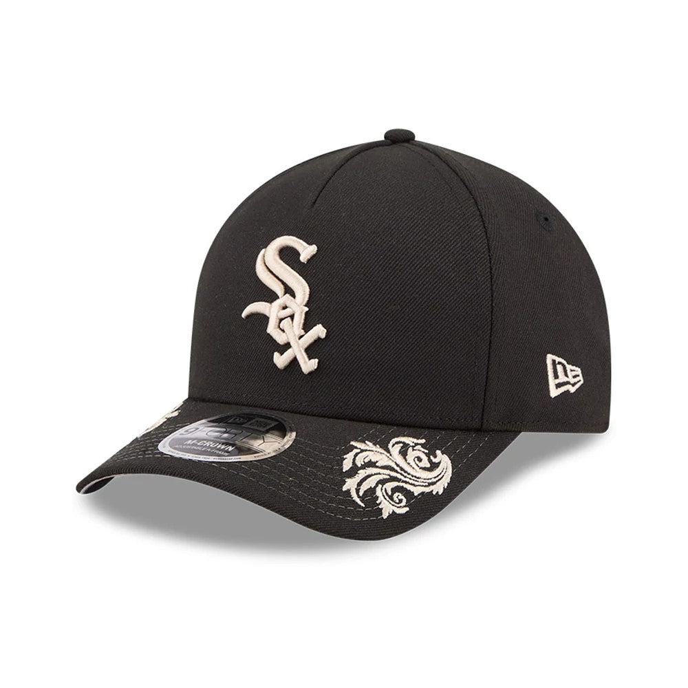 Chicago White Sox MLB Script Black New Era 9FORTY M-Crown A-Frame Adjustable Cap, three-quarter view showing the white embroidered Sox logo on the front panel and intricate white floral patterns on the black curved visor with a 9FORTY size sticker.