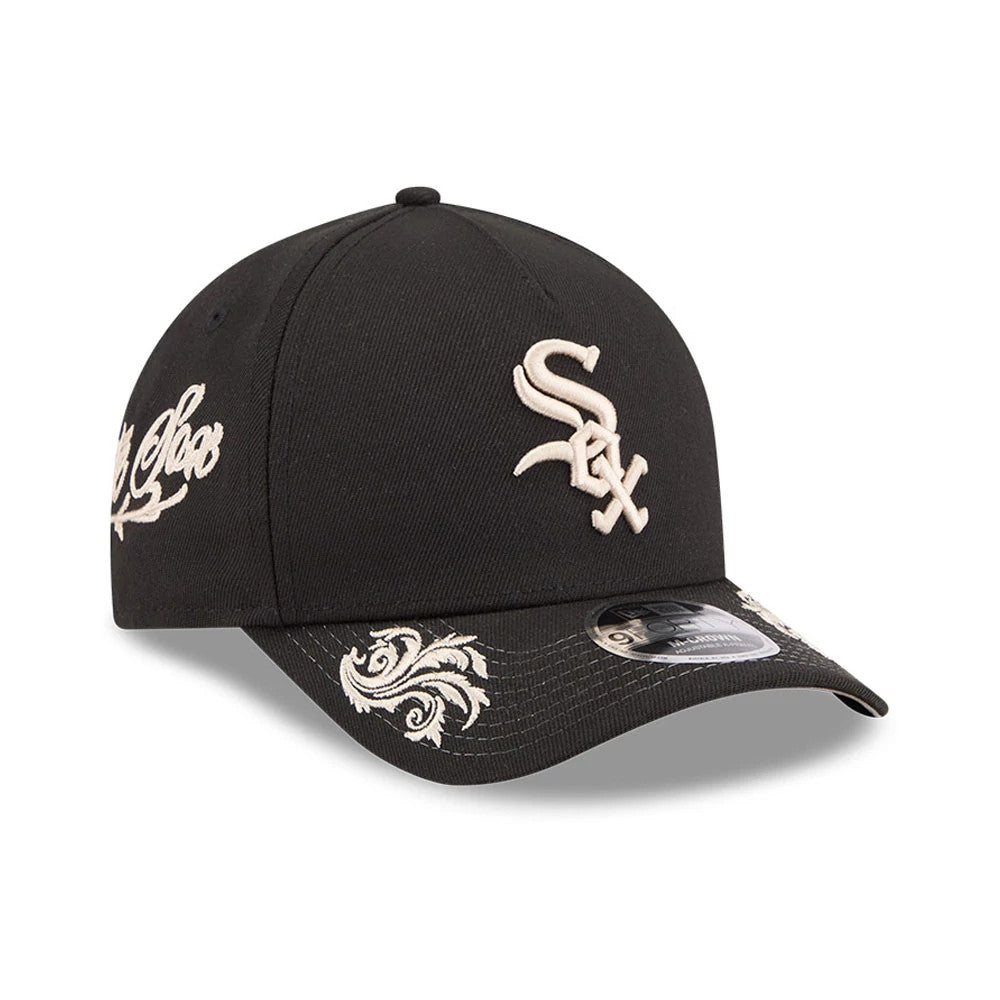 Chicago White Sox MLB Script Black New Era 9FORTY M-Crown A-Frame Adjustable Cap, three-quarter view showing the beige embroidered White Sox logo on the front panel, ornate visor pattern, and 9FORTY size sticker.