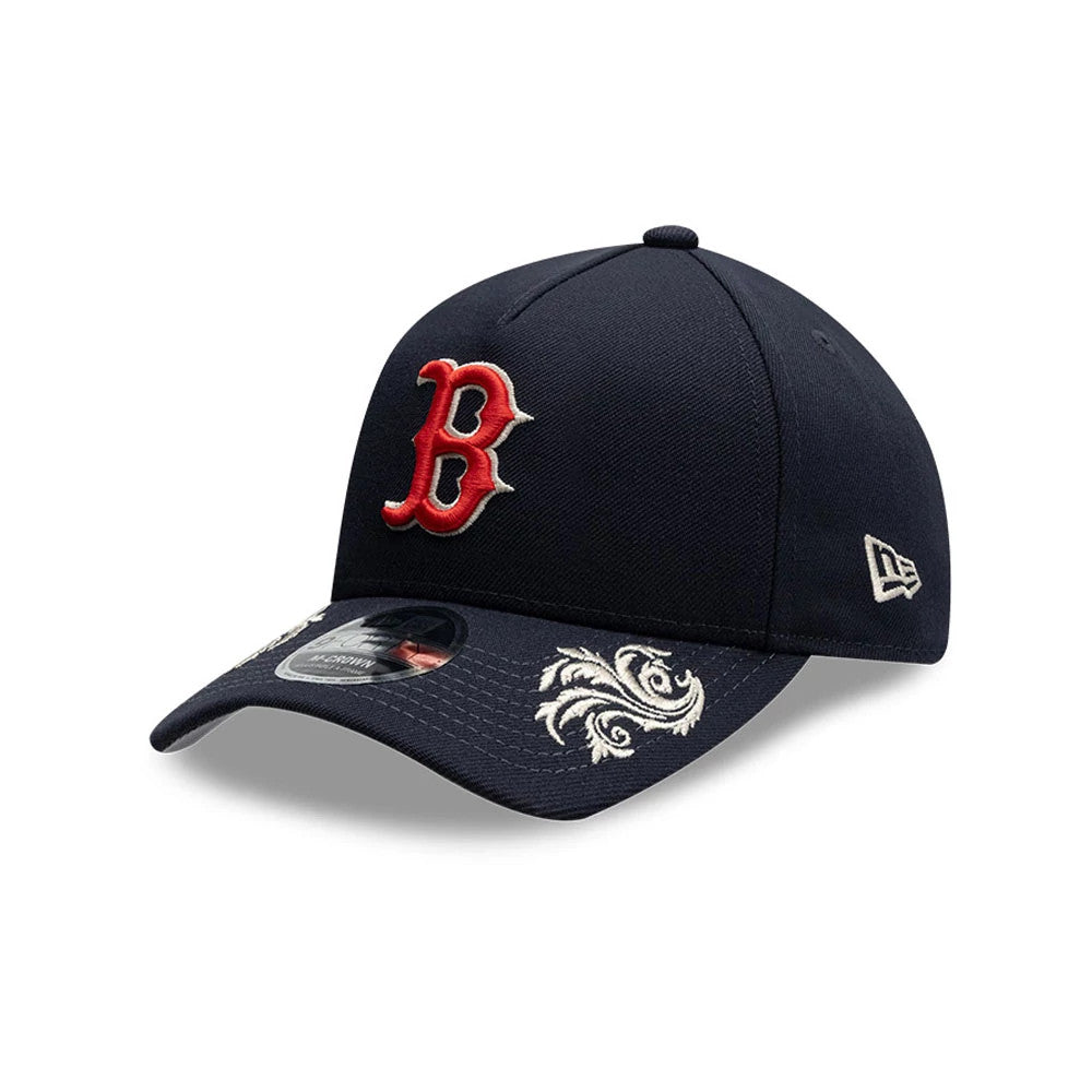 Boston Red Sox MLB Script Navy New Era 9FORTY M-Crown A-Frame Adjustable Cap, three-quarter view showing a red embroidered B logo on the front panel, curved navy visor with white embroidered pattern, and New Era flag logo on the left side.