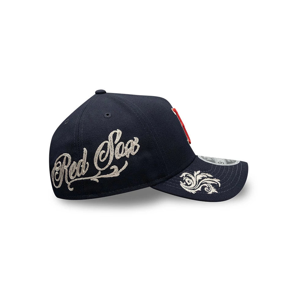 Boston Red Sox MLB Script Navy New Era 9FORTY M-Crown A-Frame Adjustable Cap, side view showing white embroidered Red Sox script on the side panel and intricate embroidery on the navy curved visor with a 9FORTY size sticker.