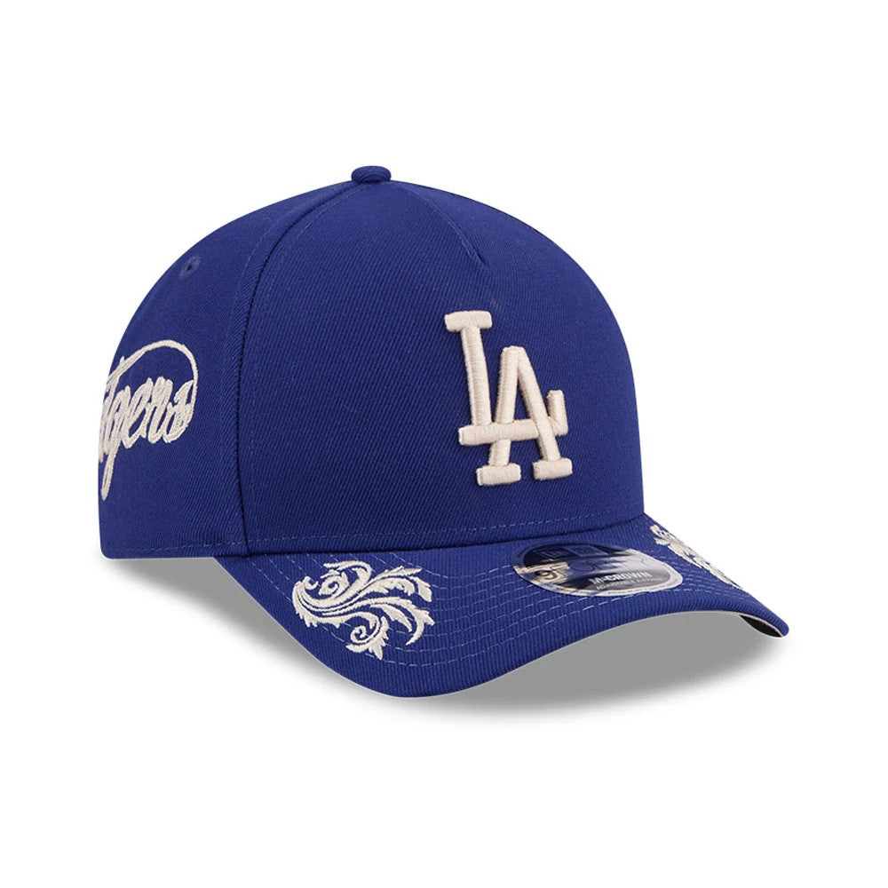 Pictured is this MLB Script LA Dodgers 9FORTY M-Crown A-Frame Adjustable cap in dark blue. 1