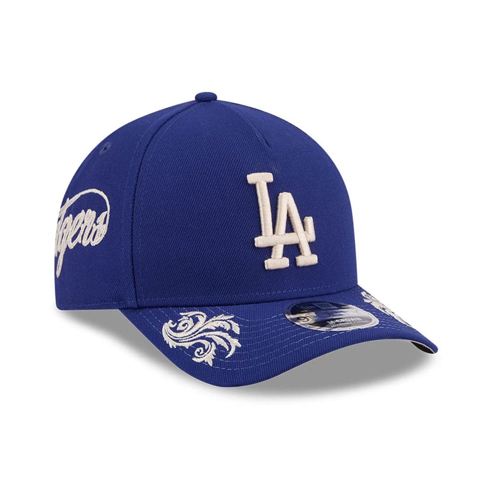 Pictured is this MLB Script LA Dodgers 9FORTY M-Crown A-Frame Adjustable cap in dark blue. 1