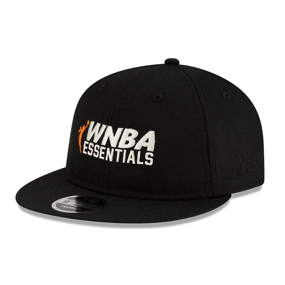 FOG x WNBA Logo Black Retro Crown New Era 9FIFTY Adjustable Cap, front view showing raised white and orange WNBA Essentials embroidery on the front panel, with a curved visor and a 9FIFTY size sticker on the black visor.
