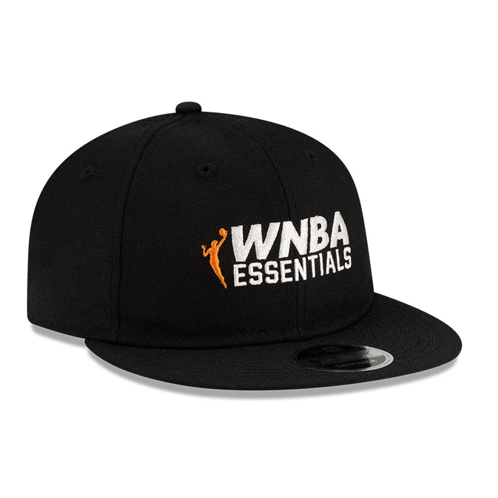 FOG x WNBA Logo Black Retro Crown New Era 9FIFTY Adjustable Cap, three-quarter view showing the white and orange WNBA Essentials logo in raised embroidery on the front panel, with a flat black visor and a 9FIFTY size sticker.