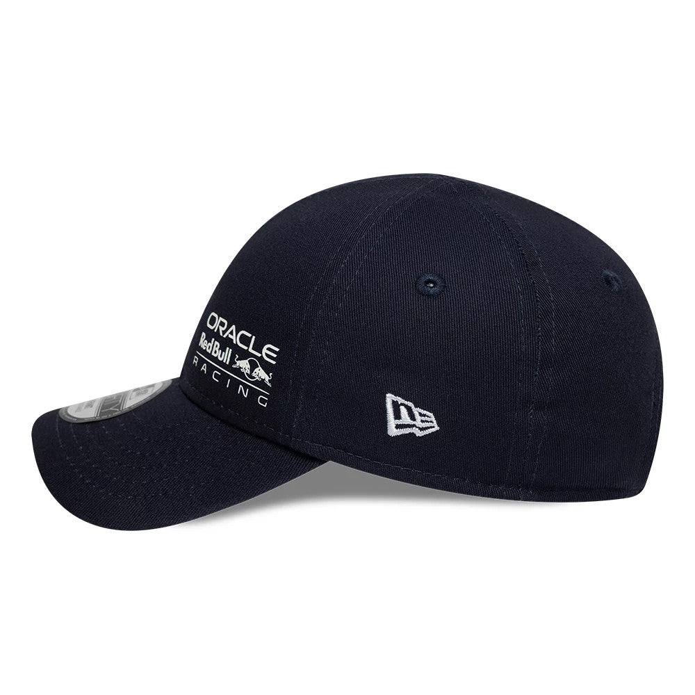 Red Bull Racing Infant My 1st Knit Dark Blue New Era 9FORTY Adjustable Cap, side view showing the white embroidered New Era flag logo on the left side and the white Oracle Red Bull Racing logo on the front panel.