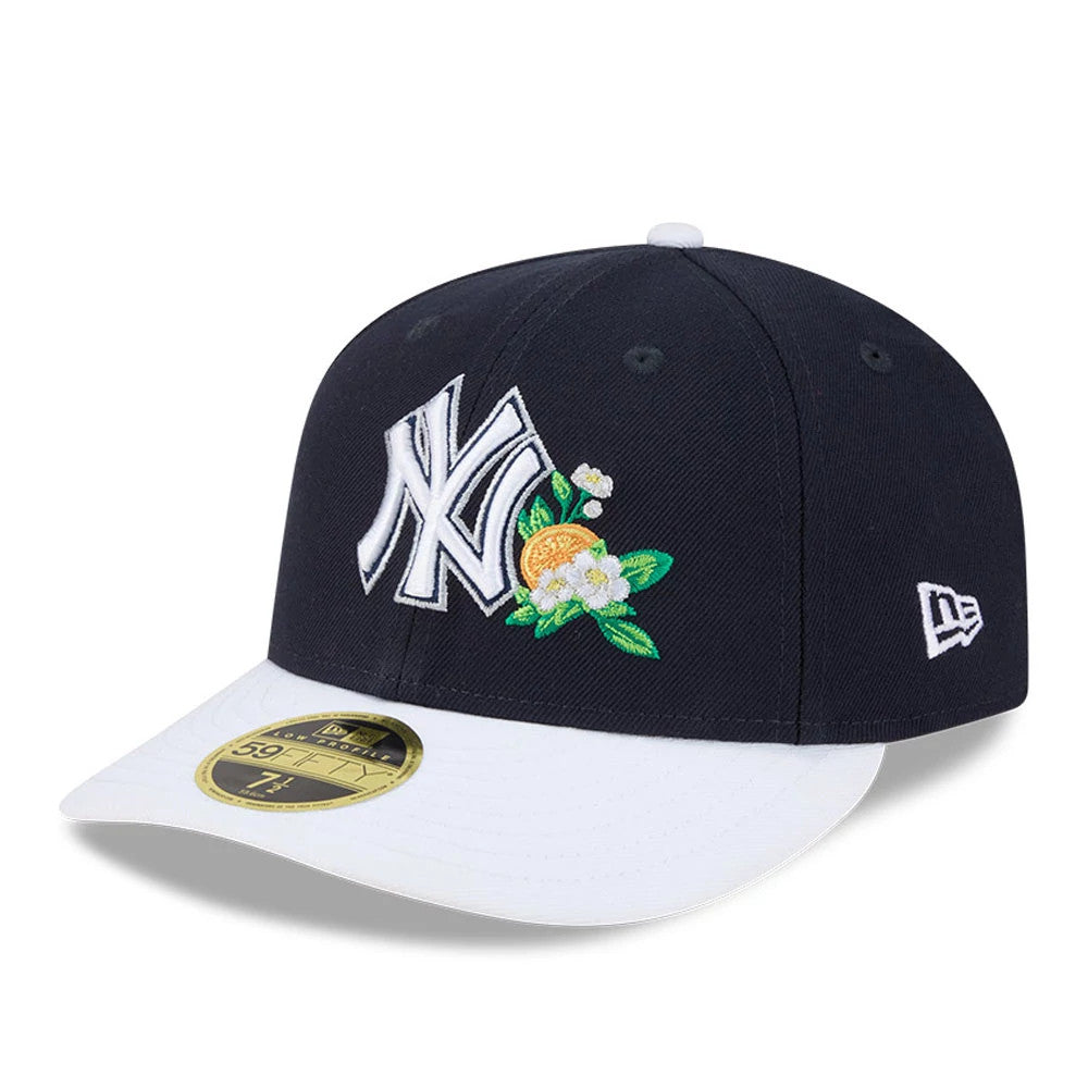 Yankees MLB Spring Training 2026 Navy Low Profile New Era 59FIFTY Fitted Cap, front view with a white embroidered NY logo and orange blossom detail on the navy crown, a contrasting white visor, and gold 59FIFTY size sticker.