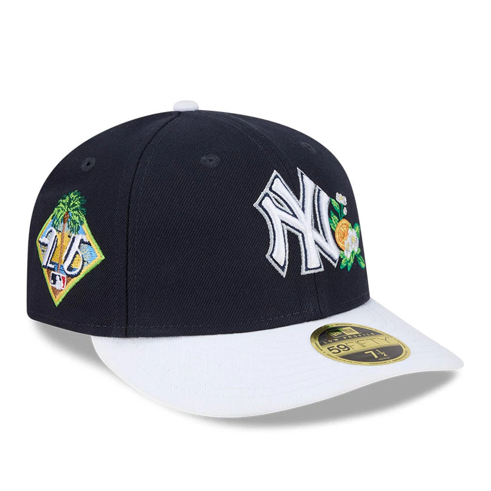Yankees MLB Spring Training 2026 Navy Low Profile New Era 59FIFTY Fitted Cap, three-quarter view showing a white raised NY logo with floral embroidery on the front panel, an embroidered 2026 Spring Training patch on the right side.