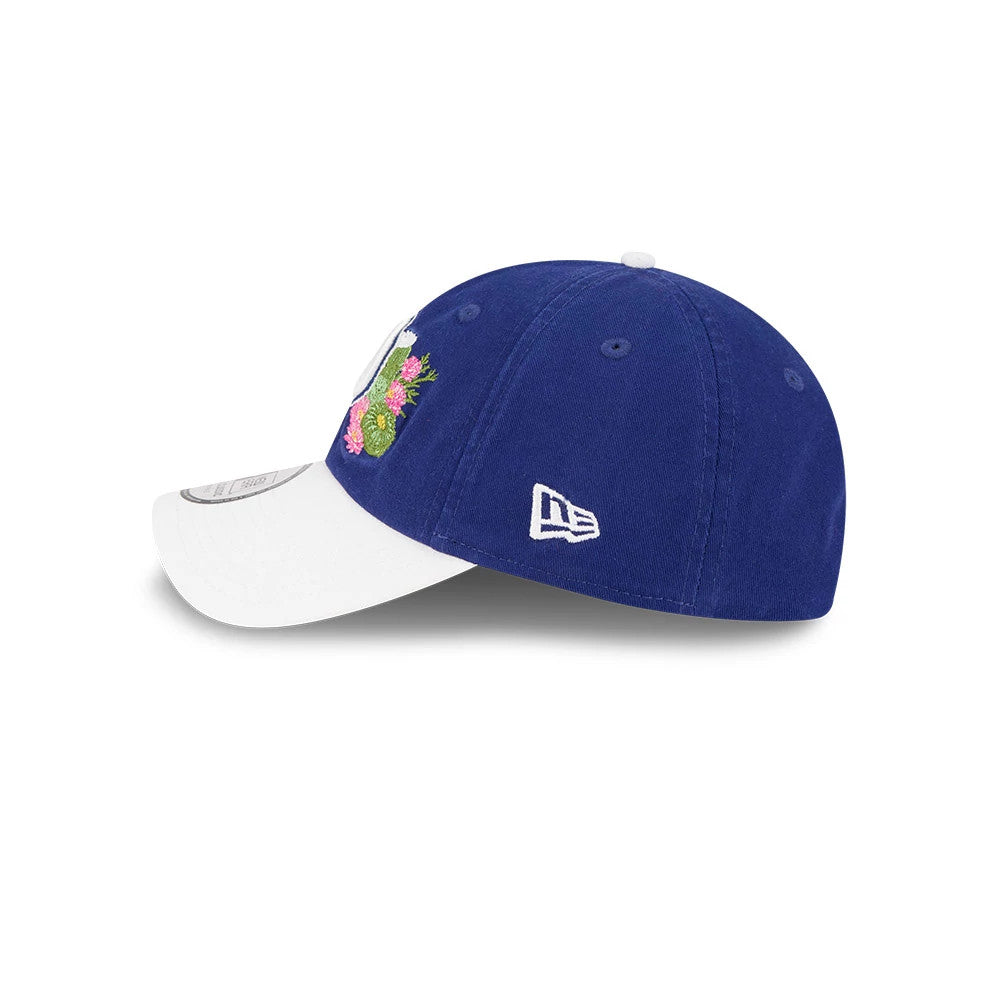 New Era LA Dodgers MLB Spring Training 2026 Dark Blue Casual Classic Adjustable Cap, side view showing the embroidered New Era flag logo on the left side, a white visor with a size sticker, and a multicoloured floral design on the crown.