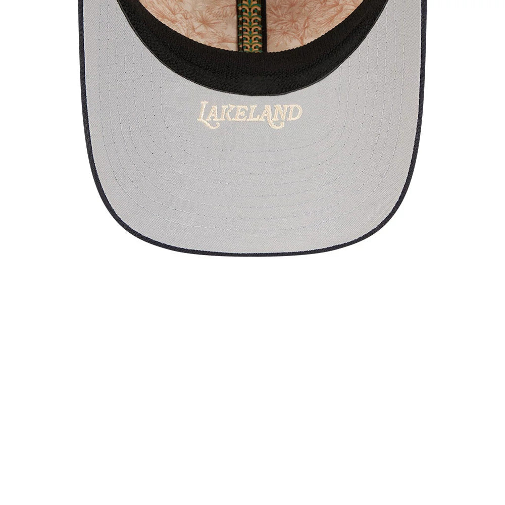 Tigers MLB Spring Training 2026 Orange New Era 39THIRTY M-Crown Stretch Fit Cap, inside view showing the green taping with New Era branding, a beige patterned sweatband, and a grey undervisor with Lakeland embroidered in beige.