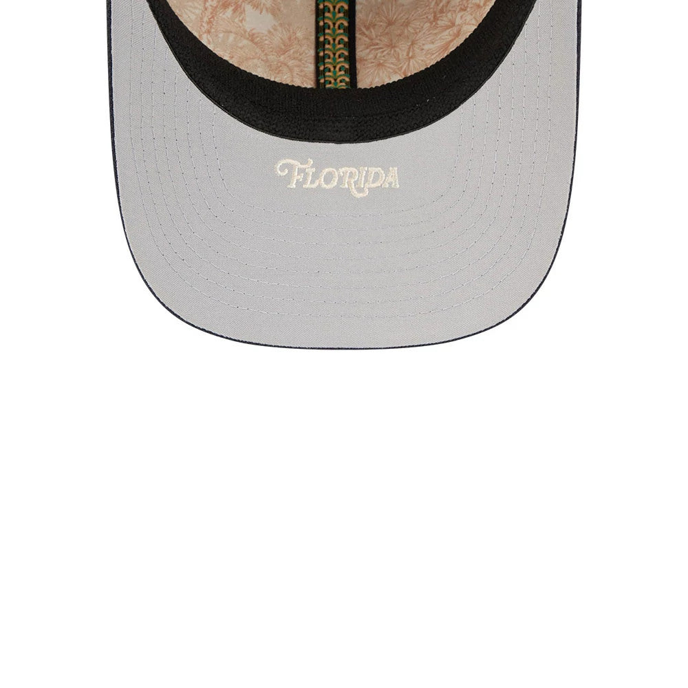 Atlanta Braves MLB Spring Training 2026 Red New Era 39THIRTY M-Crown Stretch Fit Cap, inside view showing a black sweatband, grey undervisor with Florida embroidered in white, and decorative leaf-patterned taping.