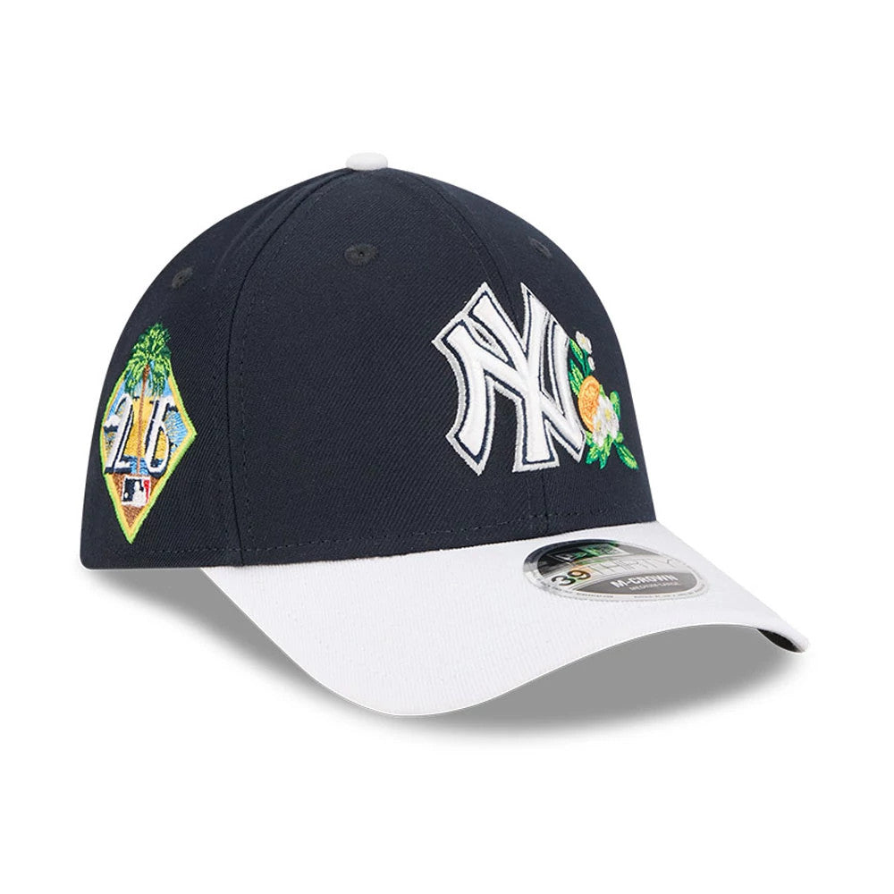 Yankees MLB Spring Training 2026 Navy New Era 39THIRTY M-Crown Stretch Fit Cap, three-quarter view showing raised white NY logo with citrus flower embroidery on front panel, palm tree patch on the side.