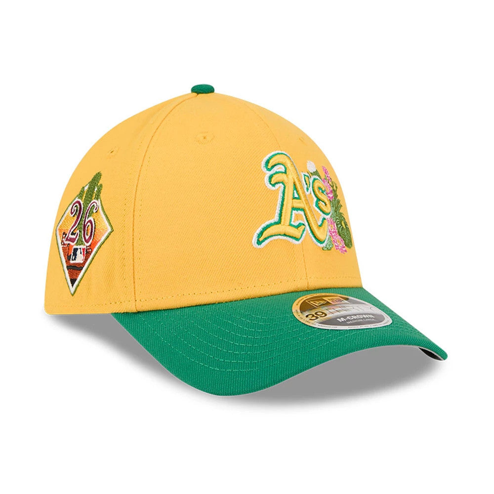 Athletics MLB Spring Training 2026 Yellow New Era 39THIRTY M-Crown Stretch Fit Cap, three-quarter view showing the green A's logo embroidered on the front panel with floral details, a green curved visor and a 39THIRTY size sticker.