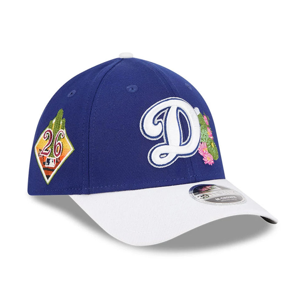LA Dodgers MLB Spring Training 2026 Blue New Era 39THIRTY M-Crown Stretch Fit Cap, three-quarter view showing the raised LA logo with cactus and floral embroidery on the front, white curved visor and a 39THIRTY size sticker.