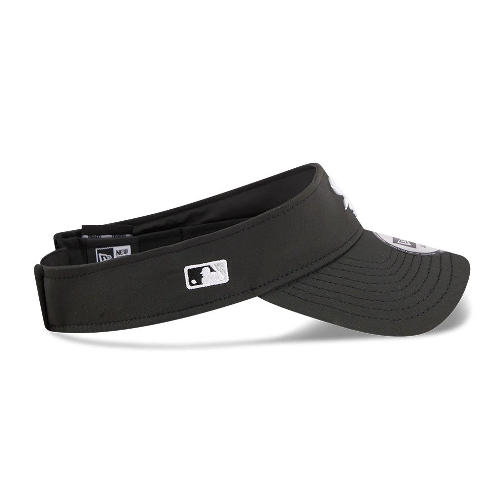 New Era Chicago White Sox MLB Spring Training 2026 Black Visor Cap, side view with the embroidered MLB Batterman logo at the centre of the band and a curved visor, showing the structure of the black crown.