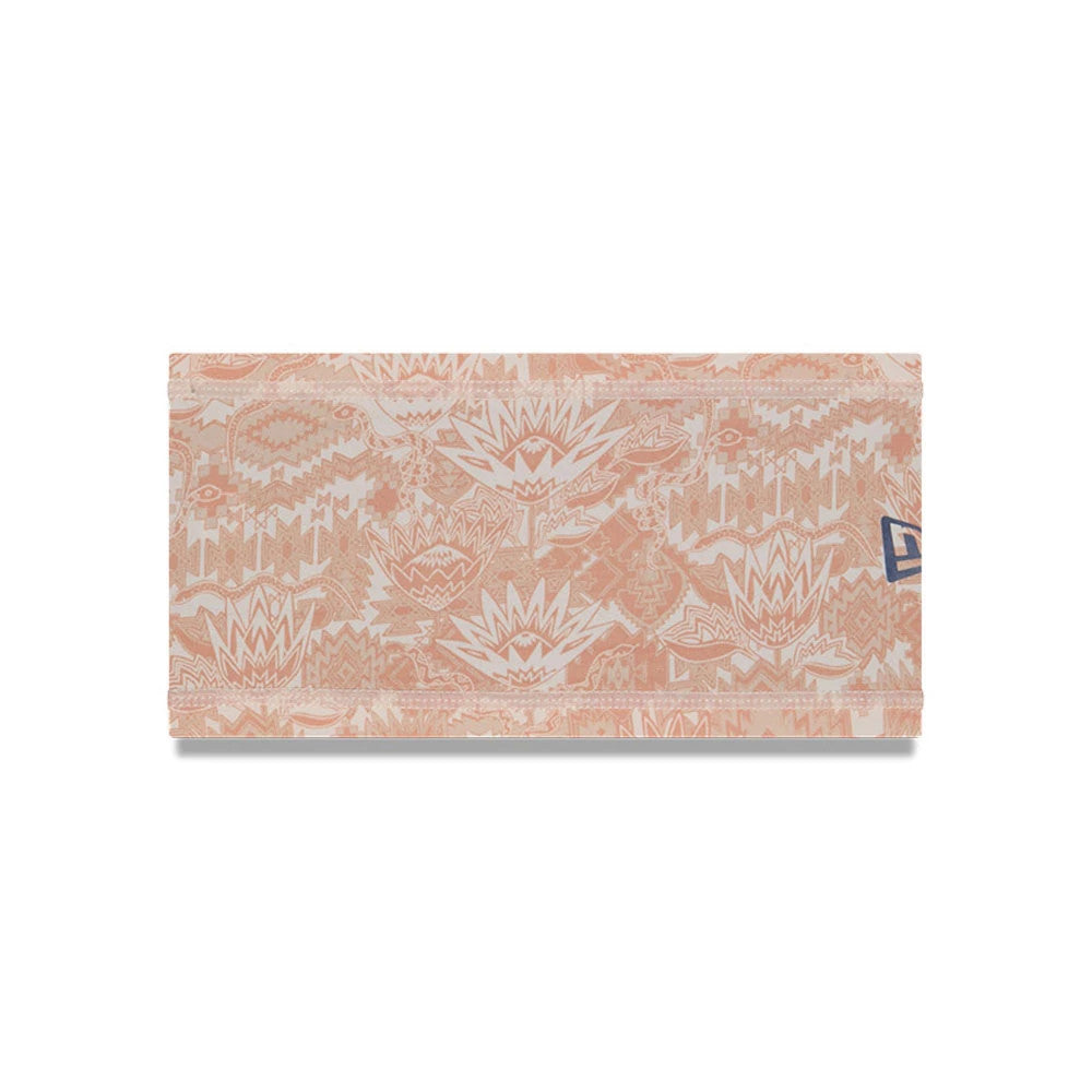 New Era Cactus League Logo MLB Spring Training 2026 All Over Print Headband, front view showing an intricate peach and cream all-over botanical pattern with geometric accents, and a New Era flag logo at the edge.