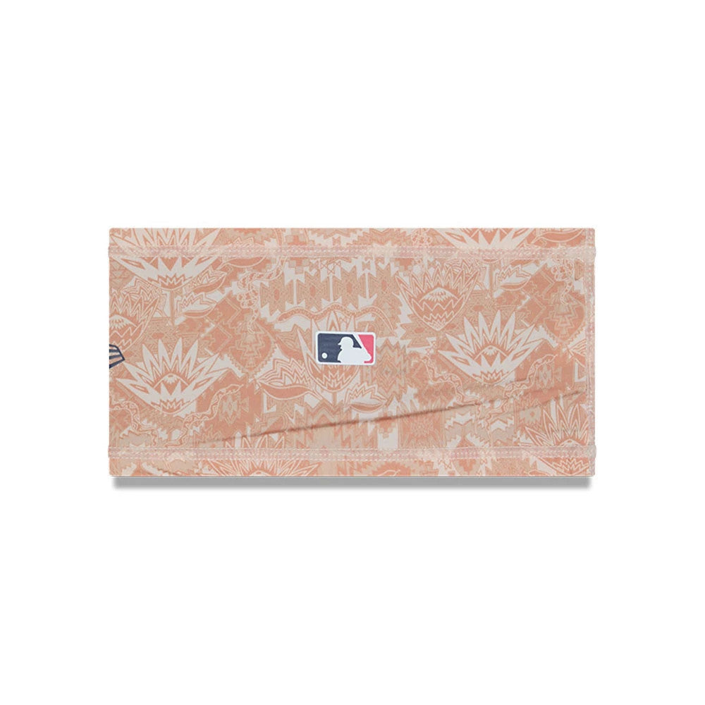 New Era Cactus League Logo MLB Spring Training 2026 All Over Print Headband, front view with a desert-themed design in orange hues, featuring the MLB logo prominently in the centre and the New Era flag logo on the side.