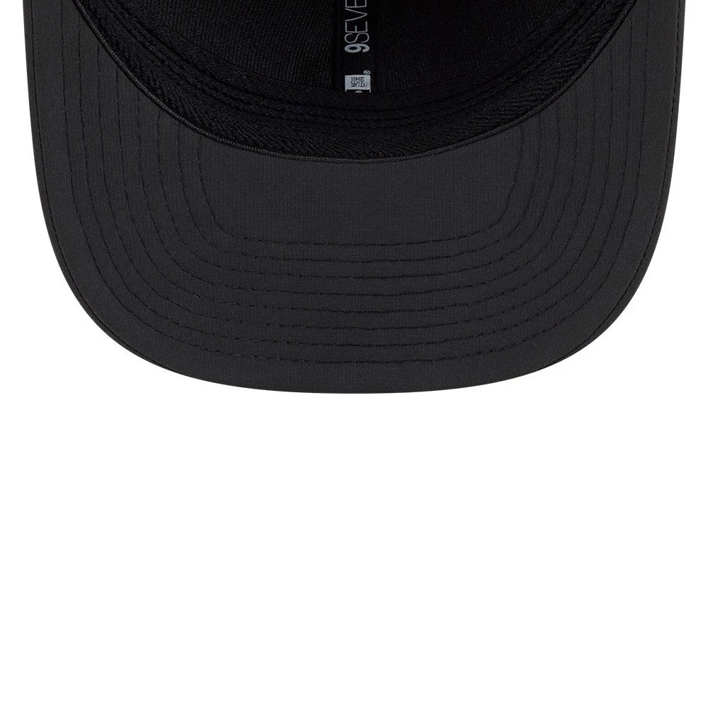 Fresno Grizzlies MiLB Clubhouse Black New Era 9SEVENTY Stretch Snap Adjustable Cap, inside view showing the black undervisor, black sweatband, and the New Era 9SEVENTY taping running across the top.