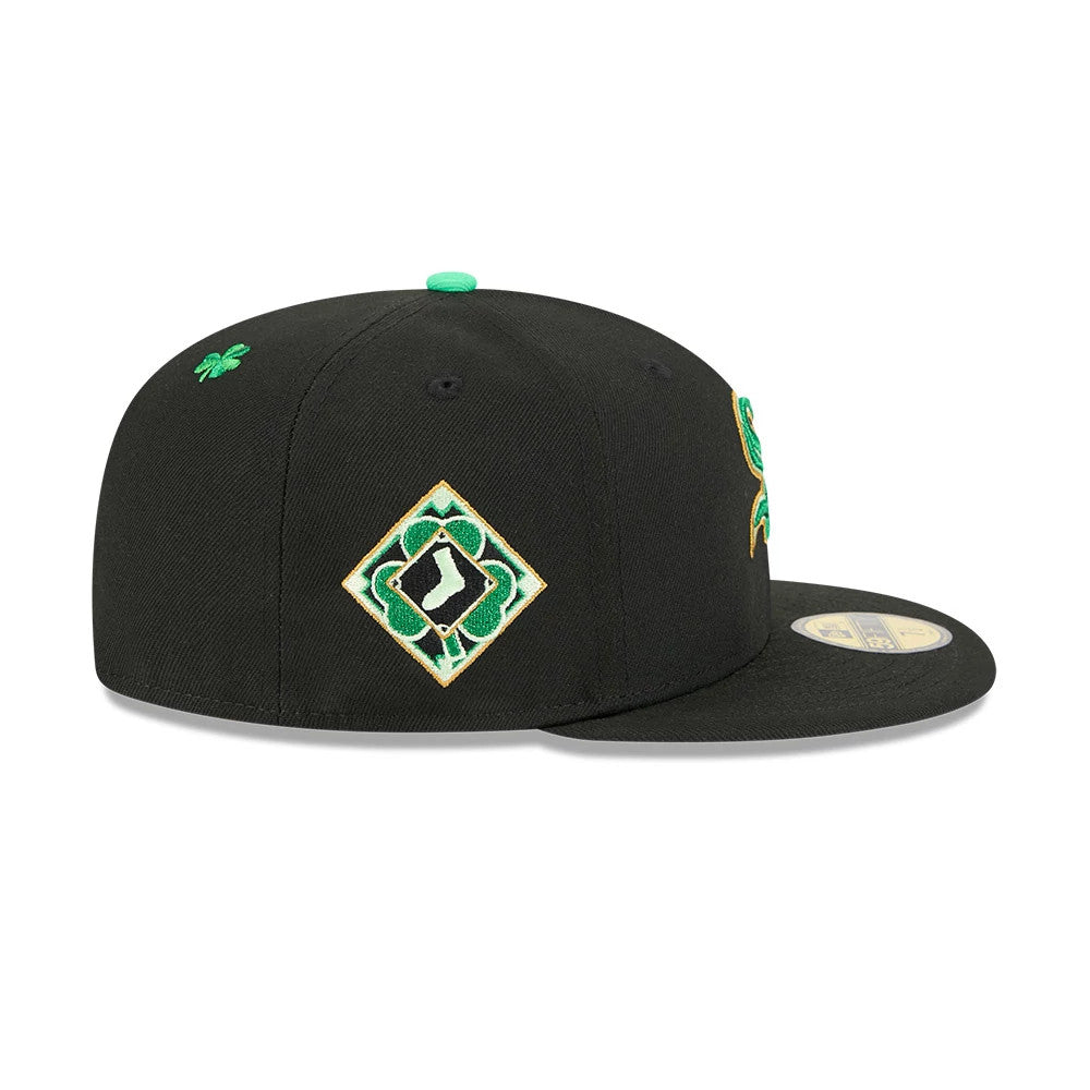 Chicago White Sox MLB Saint Patrick's Day Black New Era 59FIFTY Fitted Cap, side view showing a green shamrock embroidered on the right side with a diamond-shaped clover logo, and a gold 59FIFTY size sticker on the flat black visor.
