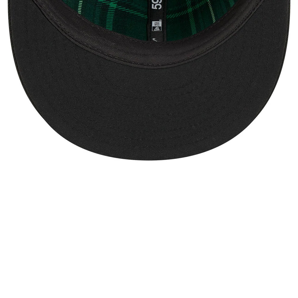Chicago White Sox MLB Saint Patrick's Day Black New Era 59FIFTY Fitted Cap, inside view showing a green plaid undervisor, black sweatband, contrasting green taping, and 59FIFTY label along the interior crown.