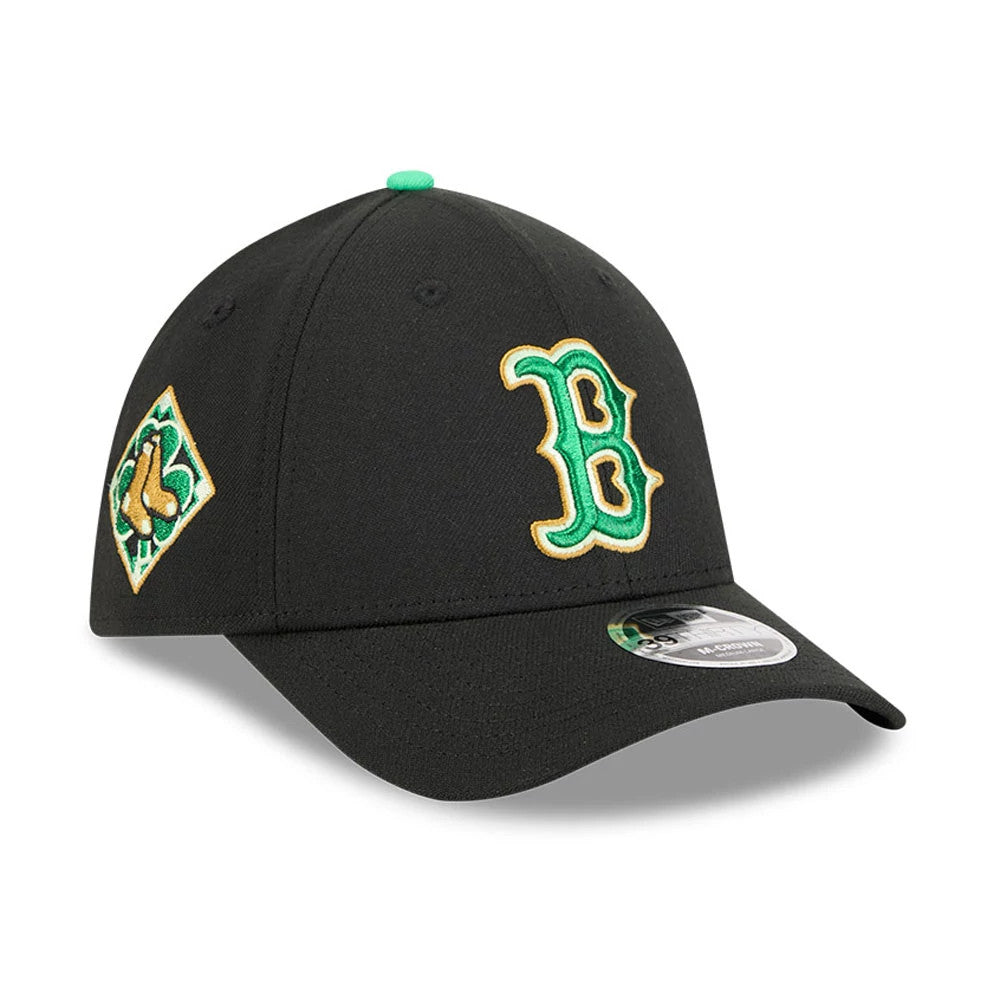 Red Sox MLB Saint Patrick's Day Black New Era 39THIRTY M-Crown A-Frame Stretch Fit Cap, three-quarter view showing the green and gold embroidered B logo on the front panel, with matching shamrock details.