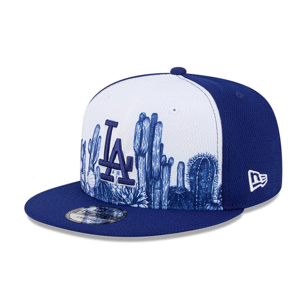 LA Dodgers MLB Grow Dark Blue New Era 9FIFTY Snapback Adjustable Cap, three-quarter view showing raised dark blue LA logo embroidered on the white front panel with a cactus graphic, dark blue visor and New Era flag logo on the left side.