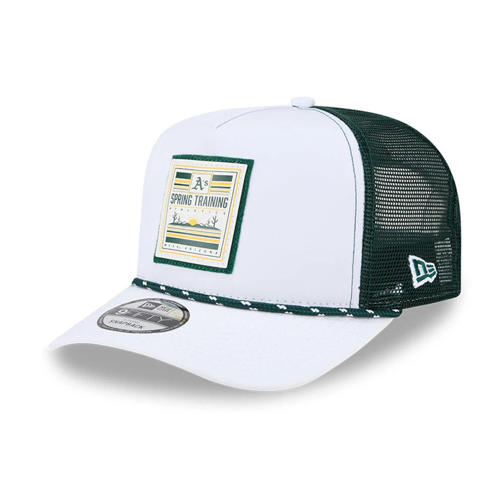 Athletics MLB Lines Dark Green New Era 9FIFTY A-Frame Snapback Adjustable Cap, three-quarter view showing a colourful Spring Training patch on the white front panel, green mesh back, and a green New Era flag logo on the left side.