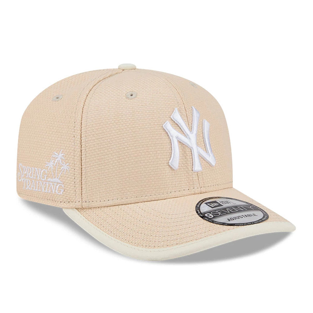New York Yankees MLB Wicker Cream New Era 9SEVENTY Stretch Snap Adjustable Cap, three-quarter view with a raised white NY logo on the front panel, Spring Training text in white on the right side, and a 9SEVENTY size sticker on the cream visor.