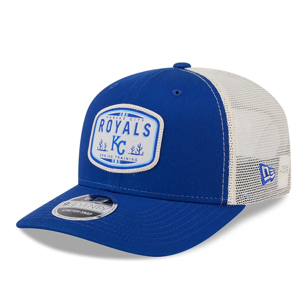 Kansas City Royals MLB Patch Blue New Era 9SEVENTY Stretch Snap Adjustable Cap, three-quarter view showing the raised embroidered KC logo on the front patch, white mesh back panels, blue curved visor and 9SEVENTY size sticker.