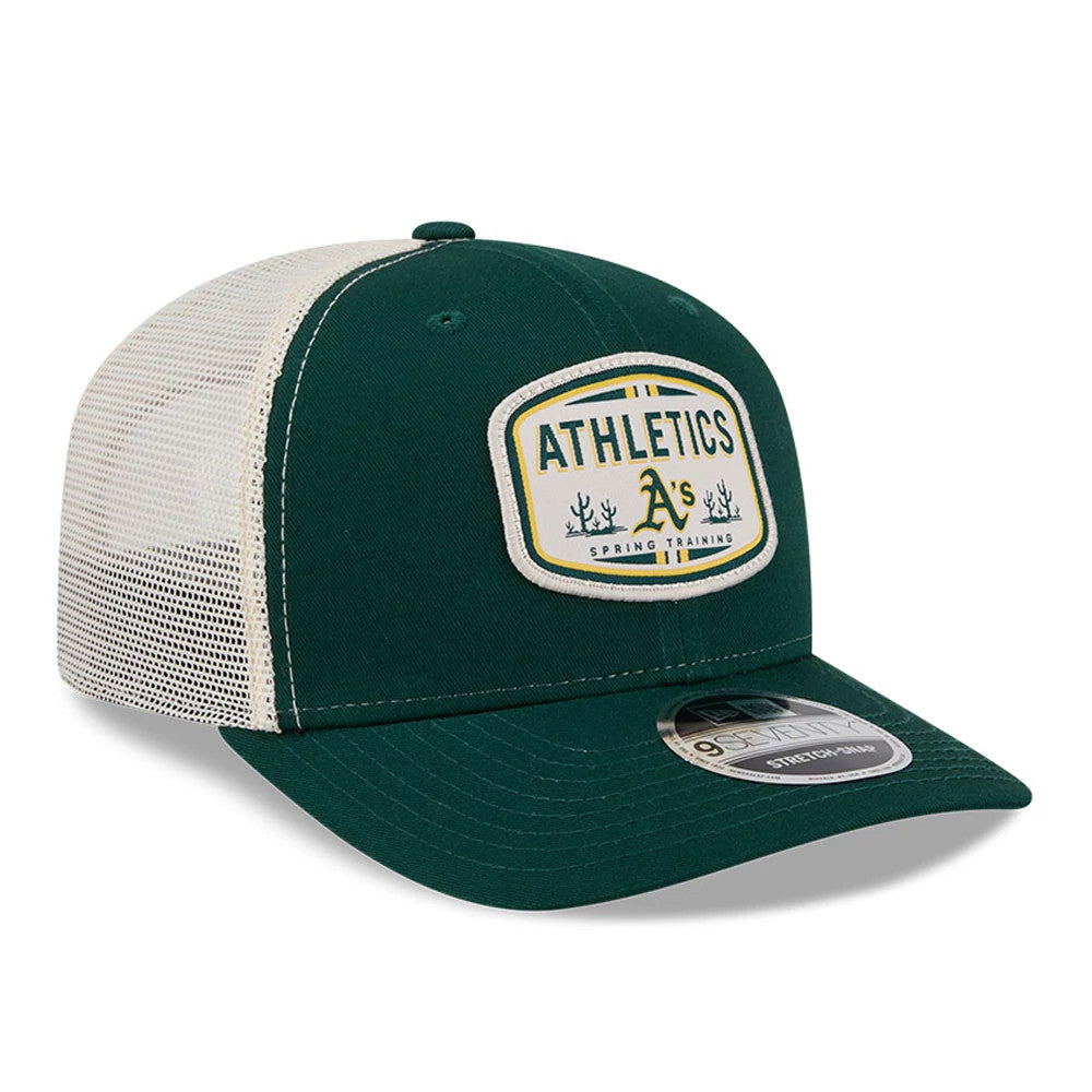 Athletics MLB Patch Dark Green New Era 9SEVENTY Stretch Snap Adjustable Cap, three-quarter view showing the raised embroidered Athletics patch on the front panel, a white mesh back, and a 9SEVENTY size sticker on the dark green curved visor.