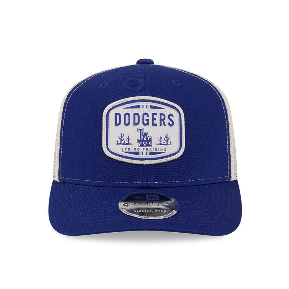 LA Dodgers MLB Patch Dark Blue New Era 9SEVENTY Stretch Snap Adjustable Cap, front view showing a white embroidered Dodgers spring training patch on the structured dark blue crown, with a curved visor and a 9SEVENTY size sticker.