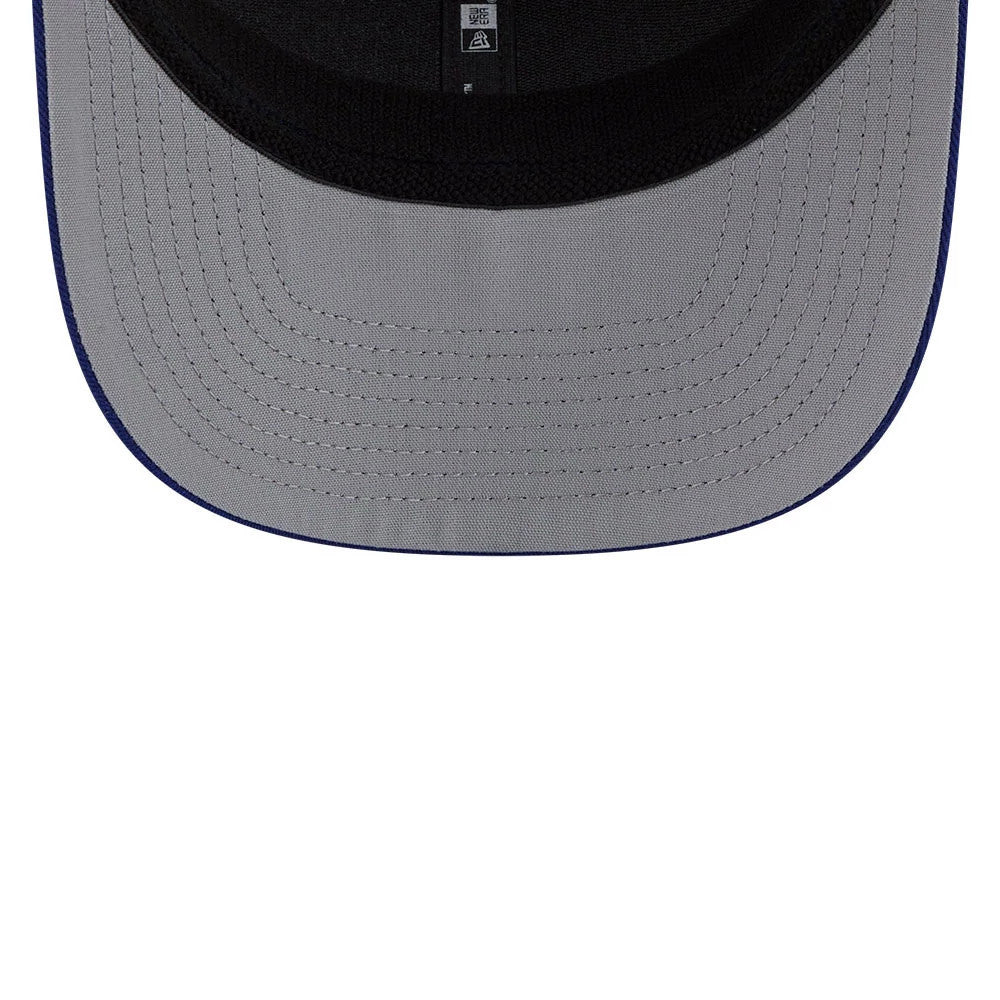 LA Dodgers MLB Patch Dark Blue New Era 9SEVENTY Stretch Snap Adjustable Cap, inside view showing the grey undervisor with detailed stitching and the black sweatband, alongside a dark taping strip featuring branding.