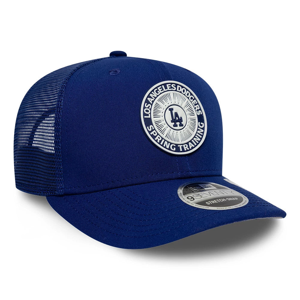 LA Dodgers MLB Circles Dark Blue New Era 9SEVENTY Stretch Snap Adjustable Cap, three-quarter view showing the raised embroidered LA Dodgers Spring Training logo on the front panel, with a dark blue curved visor and a 9SEVENTY size sticker.