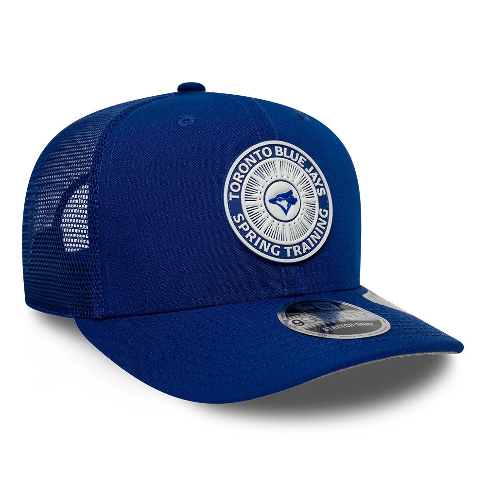 Toronto Blue Jays MLB Circles Blue New Era 9SEVENTY Stretch Snap Adjustable Cap, three-quarter view showing a blue and white embroidered front patch with the team name and logo, curved blue visor, and grey 9SEVENTY size sticker.