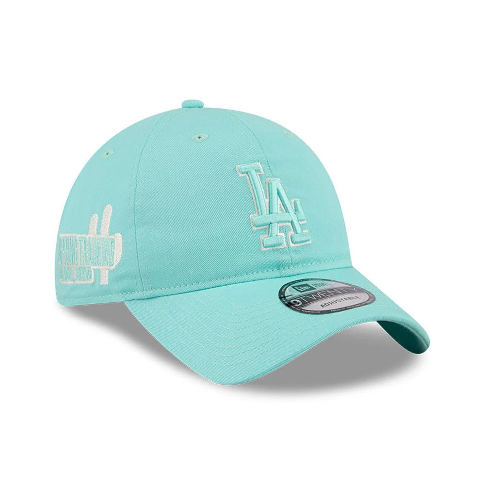 LA Dodgers MLB Colours Turquoise New Era 9TWENTY Adjustable Cap, three-quarter view showing the white embroidered LA logo on the front panel, curved visor with 9TWENTY size sticker, and embroidered text on the right side.