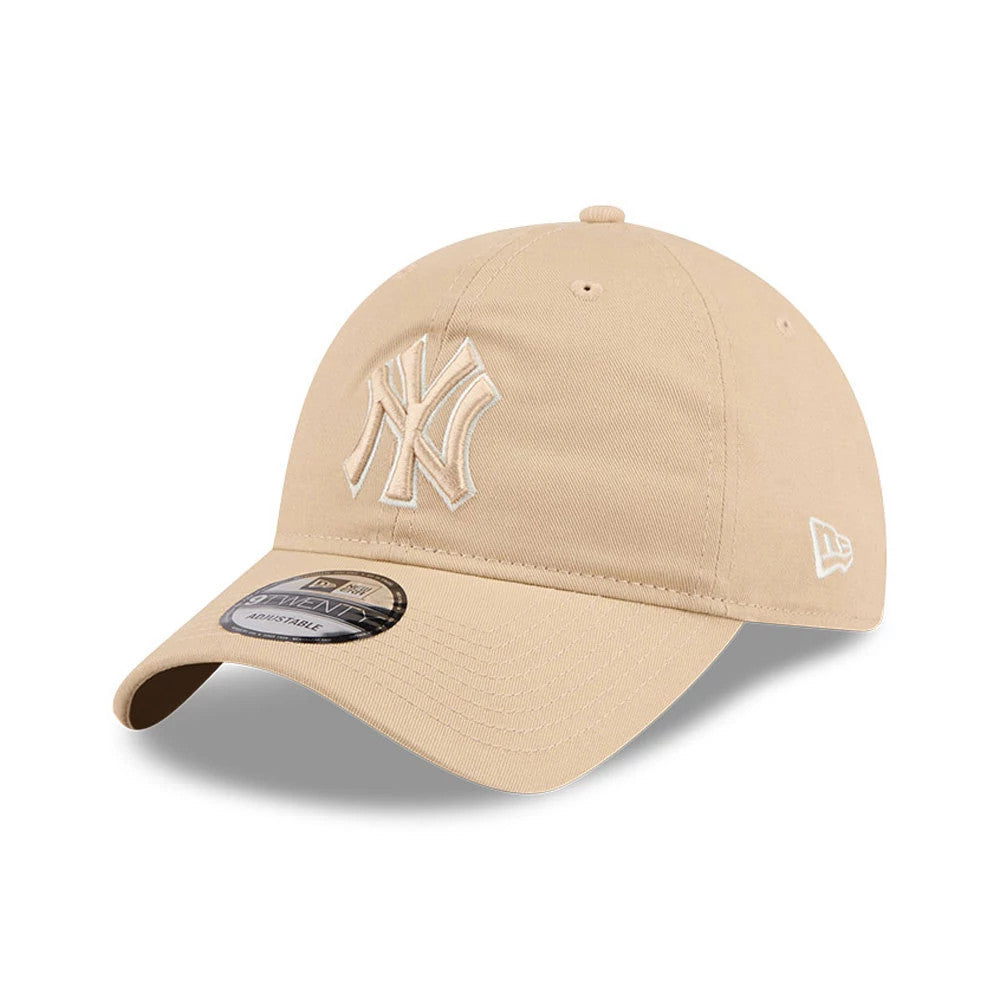 New York Yankees MLB Colours Light Beige New Era 9TWENTY Adjustable Cap, three-quarter view showing the raised beige New York Yankees logo on the front panel, with a curved visor and a 9TWENTY size sticker on the visor.