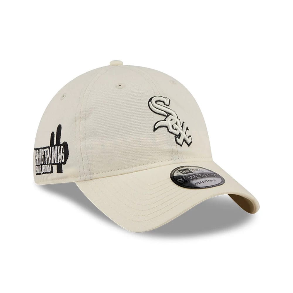 Chicago White Sox MLB Colours White New Era 9TWENTY Adjustable Cap, three-quarter view showing the raised embroidered Sox logo on the front panel, black Spring Training patch on the left side, and 9TWENTY size sticker on the curved visor.