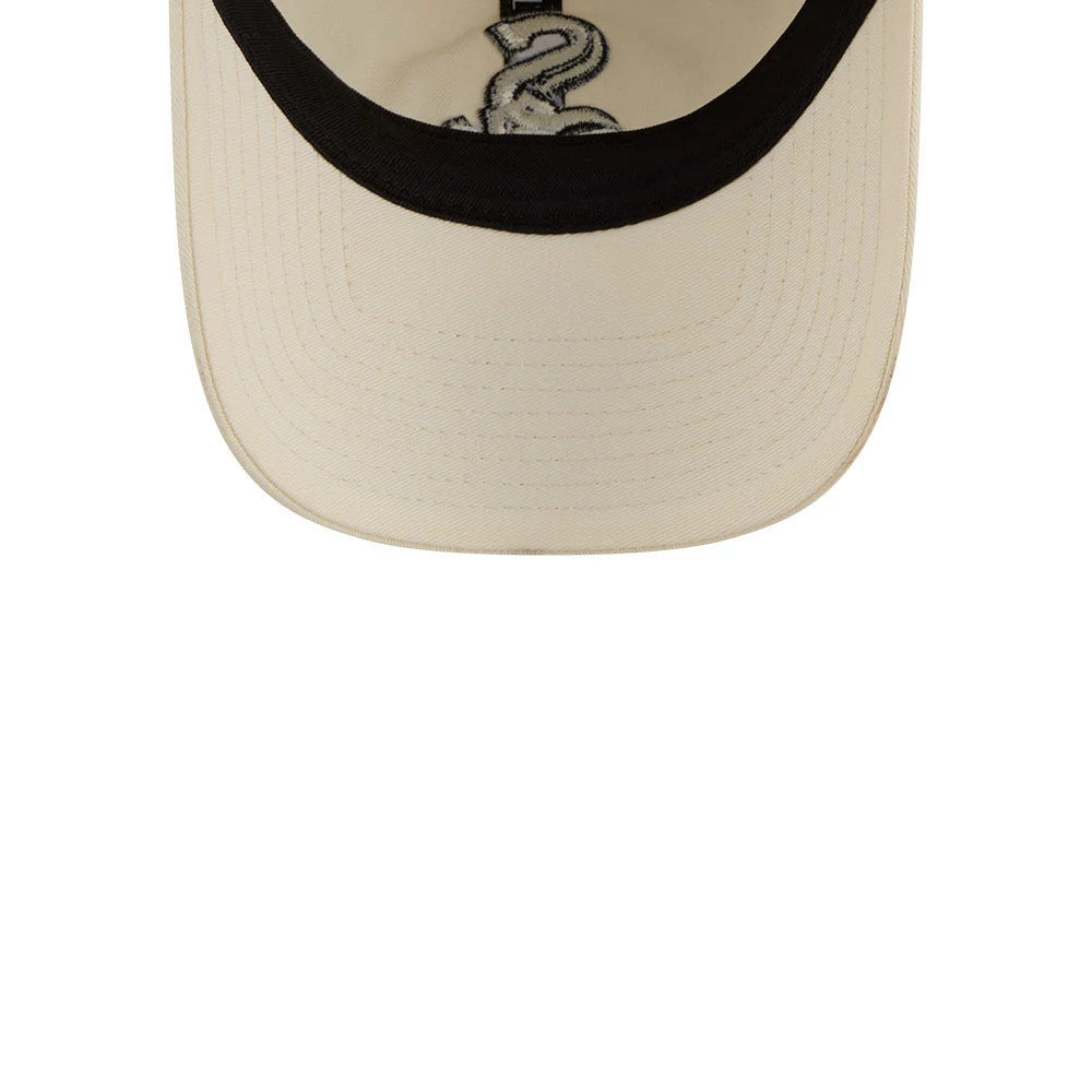 Chicago White Sox MLB Colours White New Era 9TWENTY Adjustable Cap, inside view showing the black sweatband around the edge of the white undervisor and the embroidered team logo on the fabric lining.