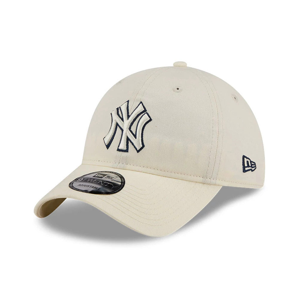 Yankees MLB Colours White New Era 9TWENTY Adjustable Cap, three-quarter view showing the navy embroidered NY logo on the front panel, curved visor with 9TWENTY size sticker, and New Era flag logo on the left side.