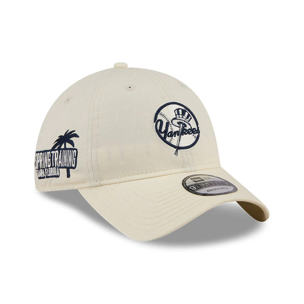 New York Yankees MLB Colours White New Era 9TWENTY Adjustable Cap, three-quarter view showing the navy embroidered Yankees logo on the front panel and Spring Training graphic on the side, with a curved visor and 9TWENTY size sticker.