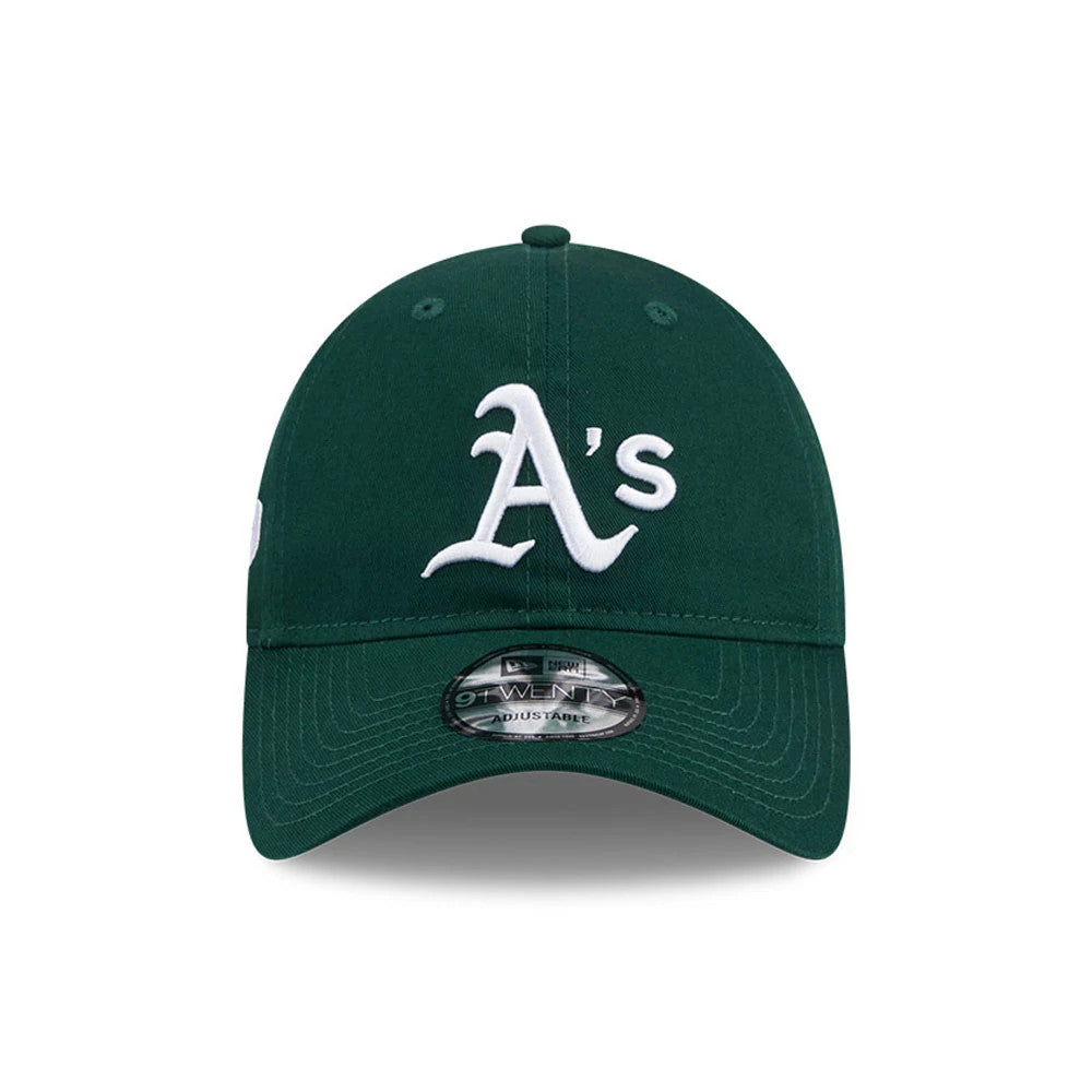 Athletics MLB Colours Dark Green New Era 9TWENTY Adjustable Cap, front view showing a raised white embroidered A's logo on the structured dark green crown and the 9TWENTY size sticker on the curved visor.